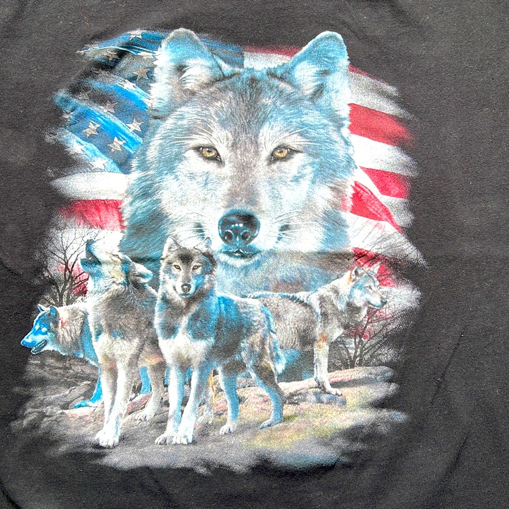 Vintage graphic t-shirt with American U.S. flag background & wolf foreground.